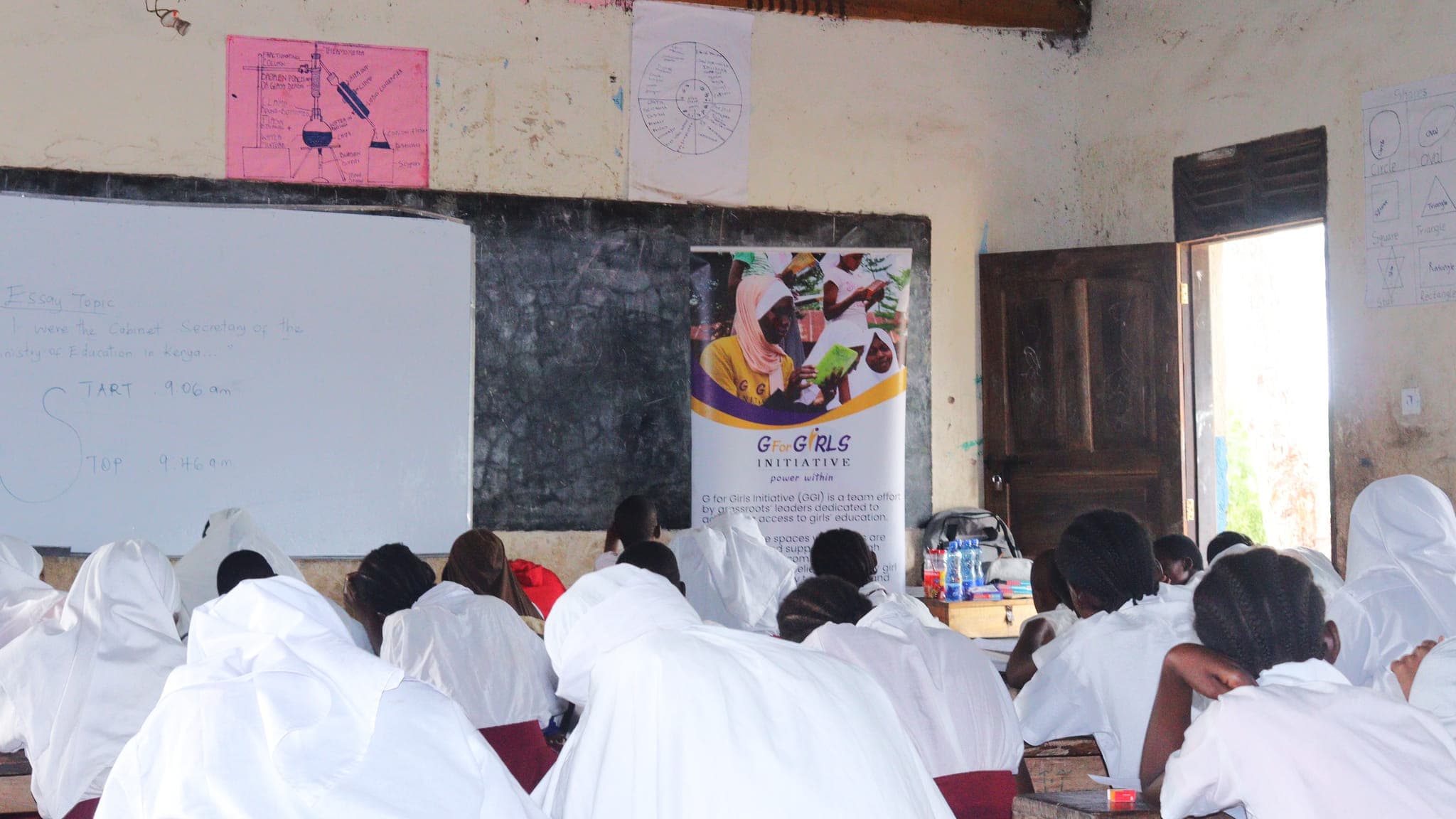 Grade 7 learners taking part in an essay-writing session at Kiwegu