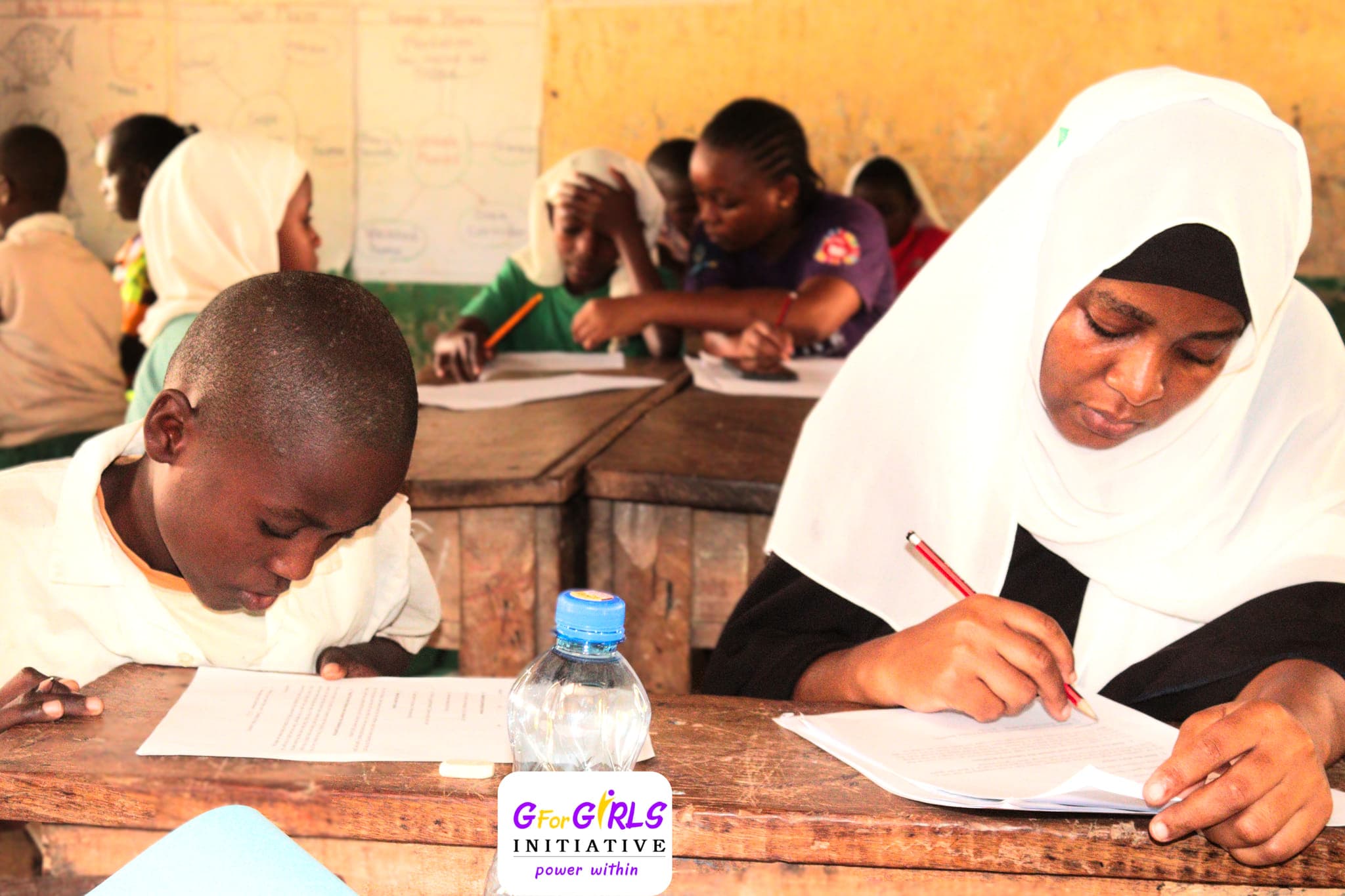 Facilitators recording results during a learning camp assessment