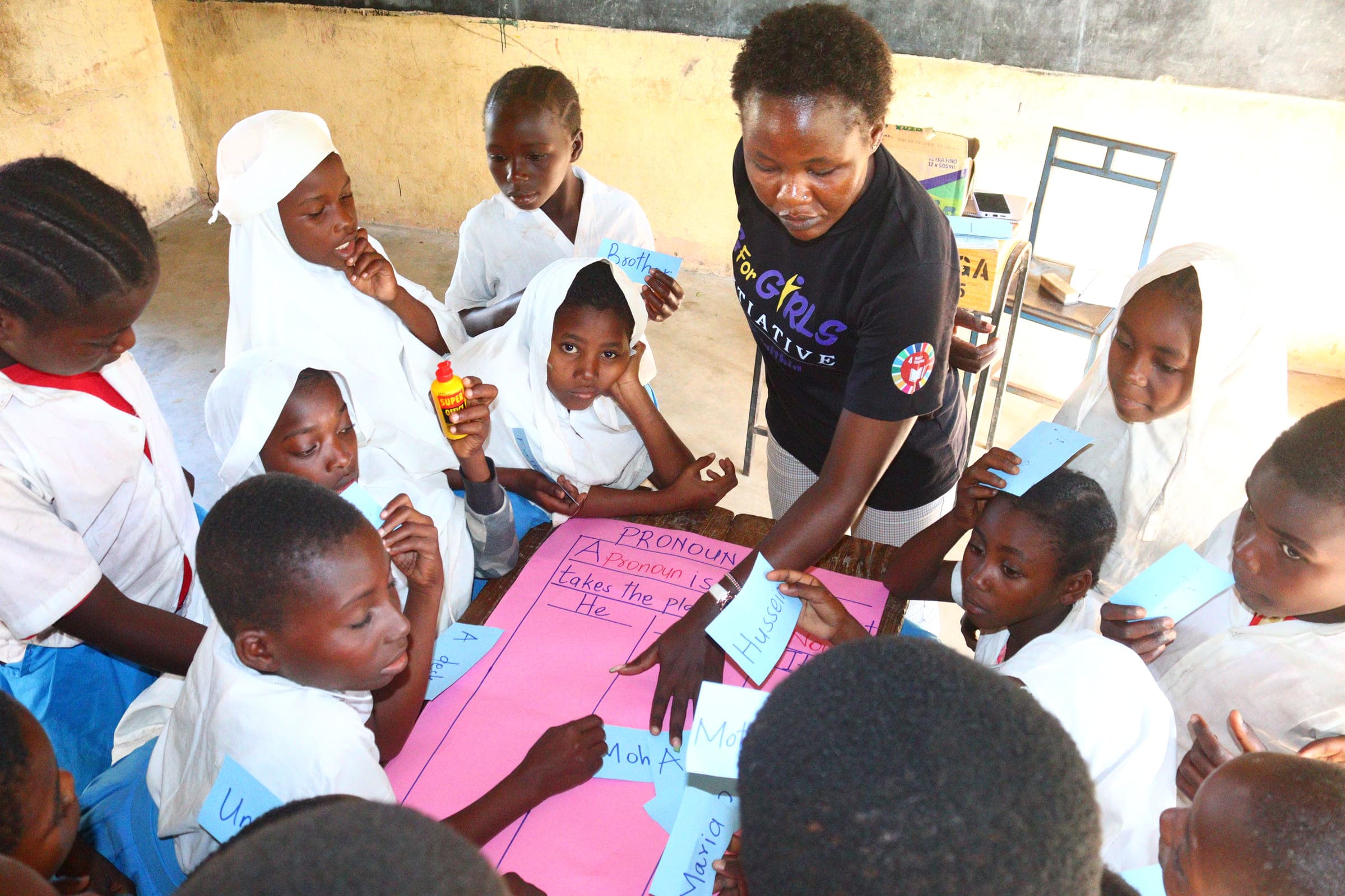 Madam Rabecca with Grade 4 learners during the 20-day learning camp at Jego