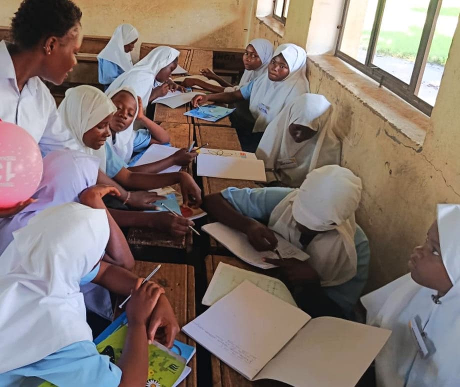 A mentorship session with Grade 7 girls at Tsuini, facilitated by Madam Rabecca