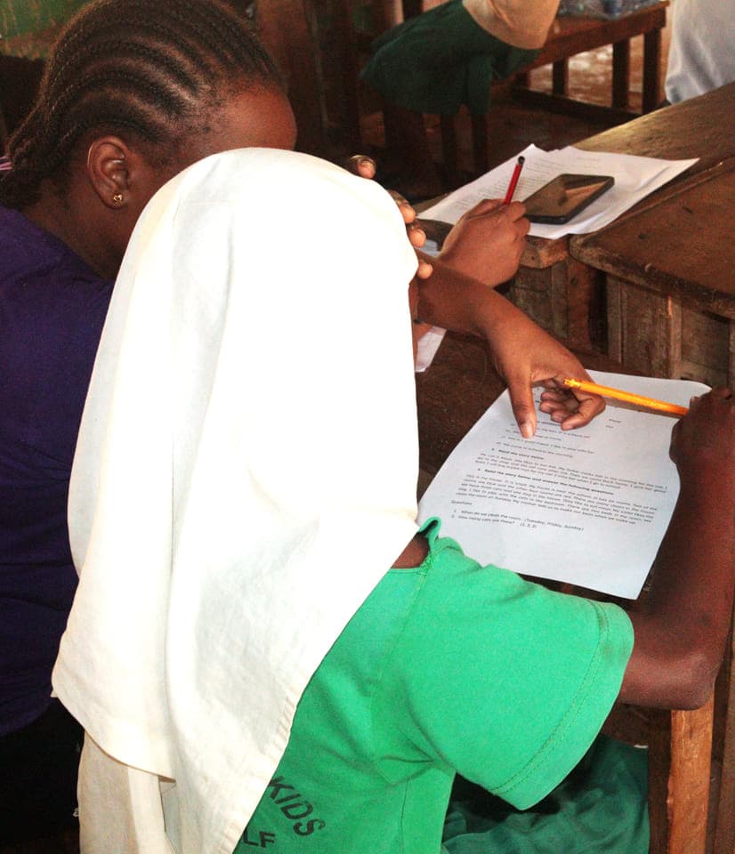 Millicent Mgalla, assistant project officer, conducting a midline assessment
