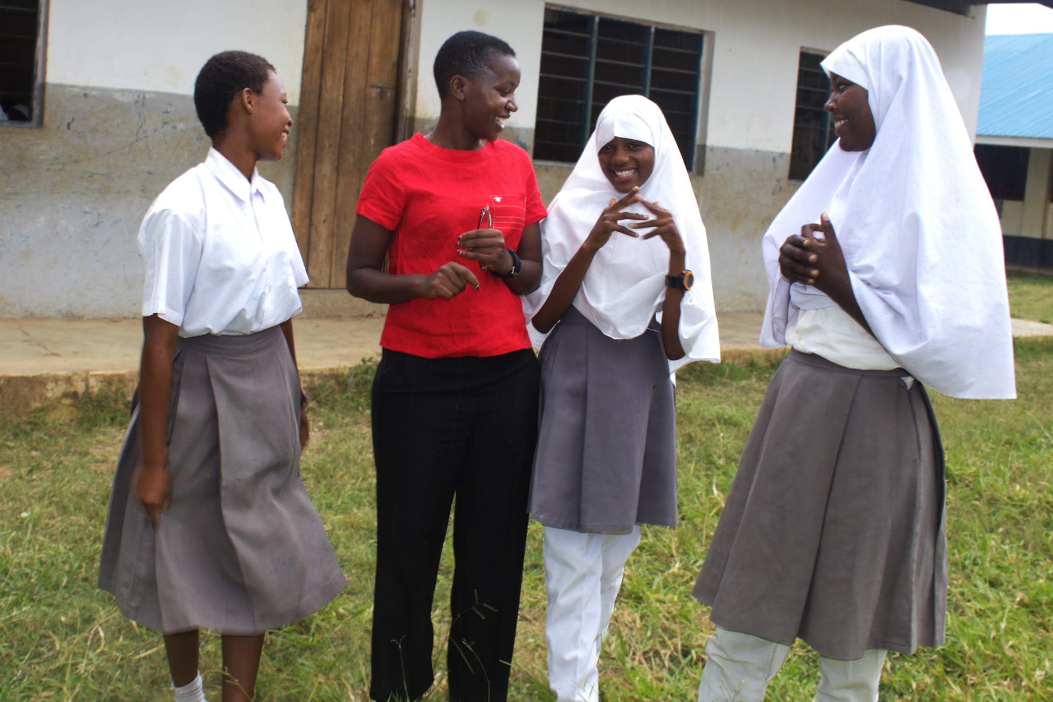 Priscah Mongera in discussion with girls at Tsuini JSS