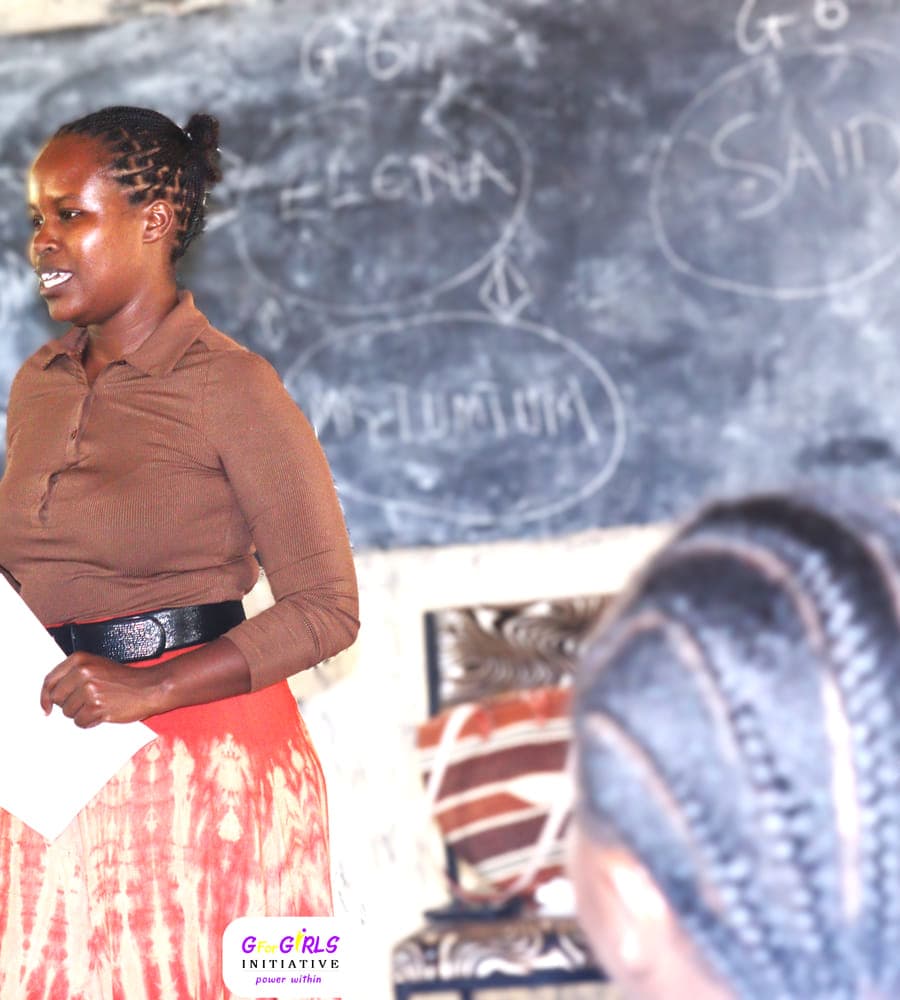 Naomy Kemei in conversation with Grade 8 and 9 learners at Mwalewa